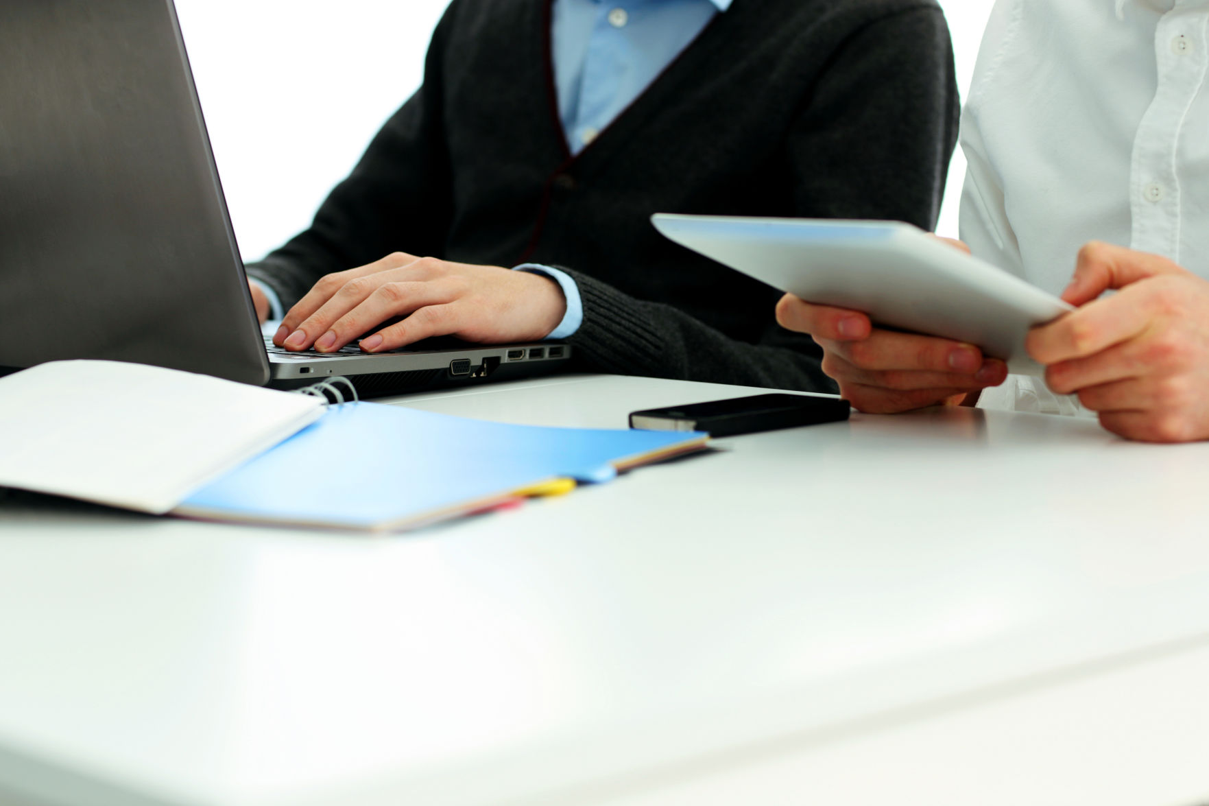 Businesspeople working in office at the table